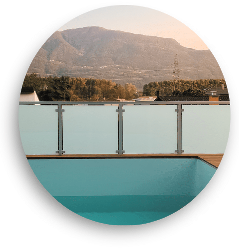 Pool fencing with frosted laminated glass and stainless steel posts – ideal for privacy and seclusion in modern pool areas.